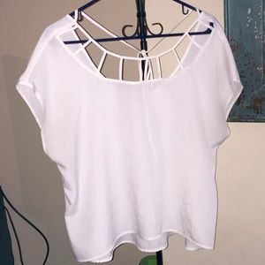 White top w/geometric cutout and tie in the back.