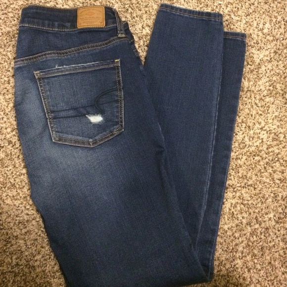 Dark wash distressed skinny jeans