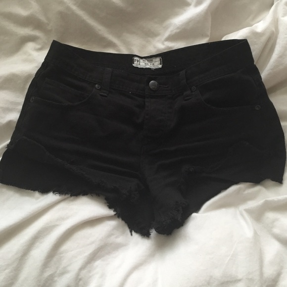 Free People black denim distressed shorts