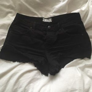 Free People black denim distressed shorts