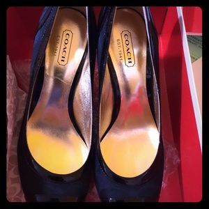 Beautiful black brand new coach shoes.