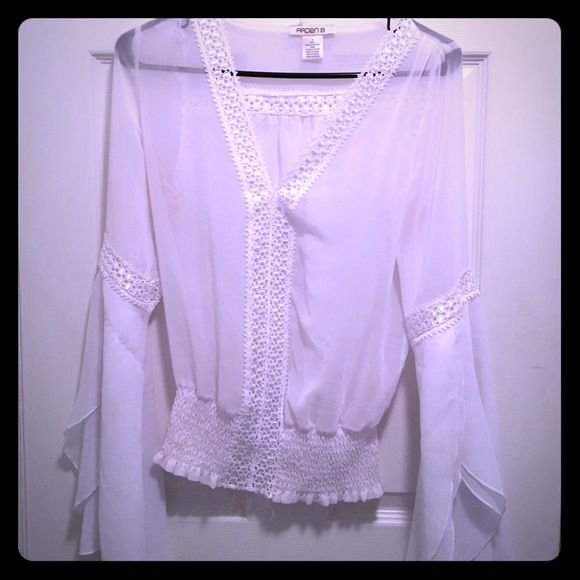 Sheer white boho top with wide and flowing sleeves