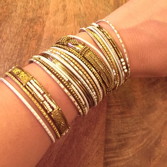 Set of white and gold bracelets