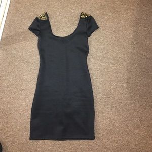 black dress with gold studded shoulder detail