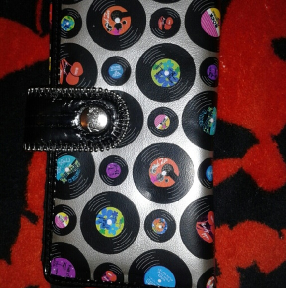 Wallet with vinyls on it. Never used.