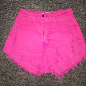 Hot pink high waist shorts.