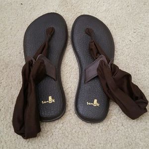 Pair of Sanuk Sandals