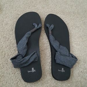Pair of Sanuk sandals