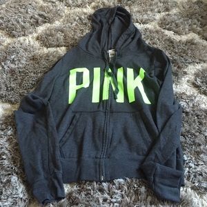 Pink zip-up hoodie.