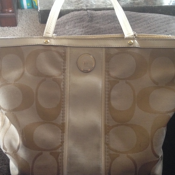 Cream & gold Coach purse. Light pink inside