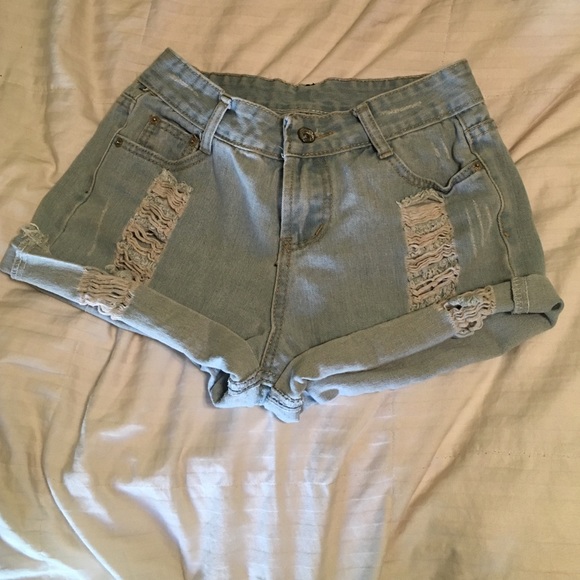 High waisted, light washed, ripped shorts.