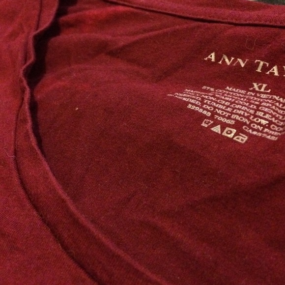 Maroon/burgundy shirt.