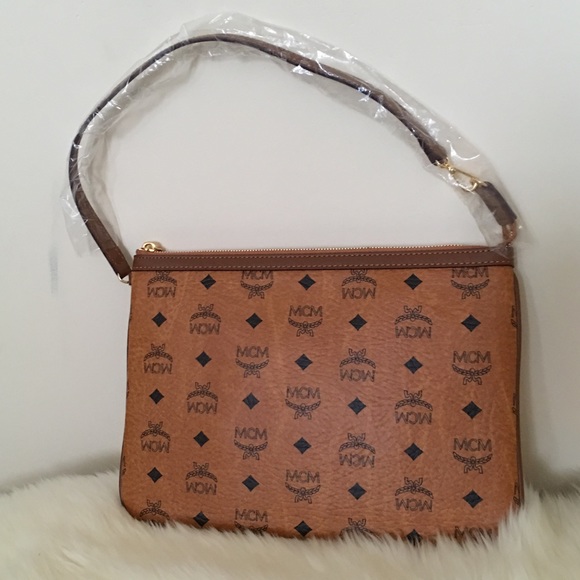 MCM Handbags - 💥🎉👏SOLD ON TRADESY👏🎉💥MCM leather pouch