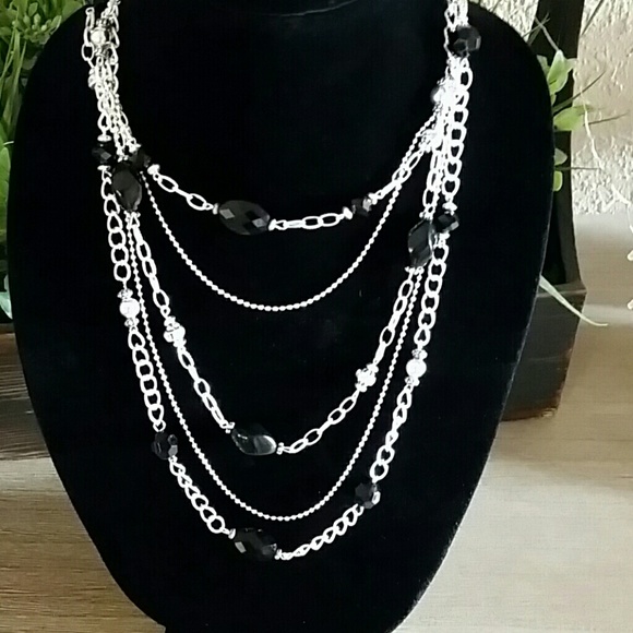 Silver and black beaded necklace.