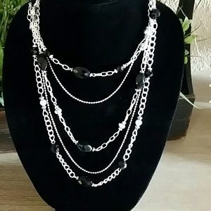 Silver and black beaded necklace.