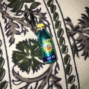 Sun tan Juicy Couture charm