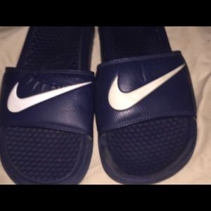 Blue Nike slides