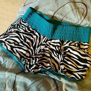 **SOLD**Zebra shorts with Teal waist and piping