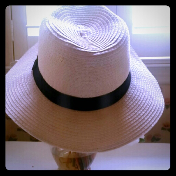 Tan hat with black ribbon