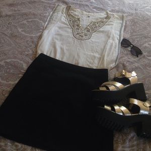 Beautiful tunic top with embellishment detail.