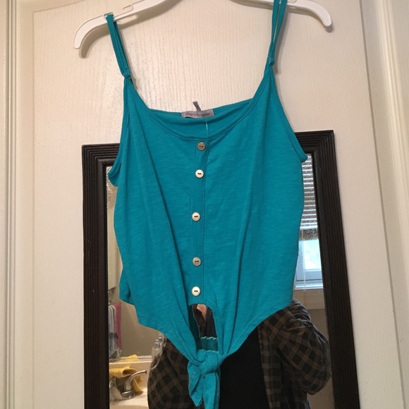 A blue button down tank top