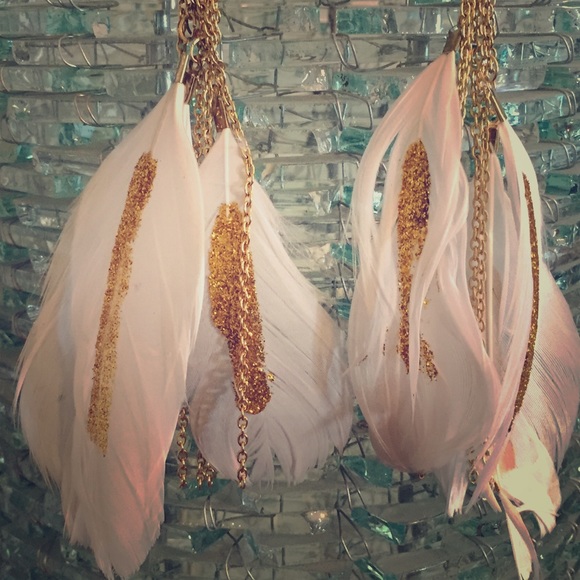 Gold feather earrings