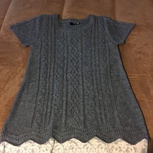 Gray sweater with lace border.