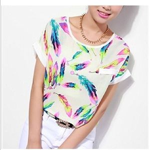 White silk blouse with various colorful feathers