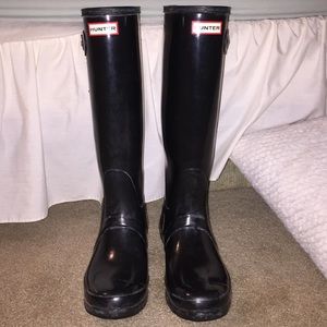 Black tall hunter boots