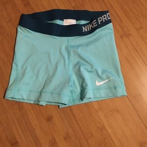 Turquoise Nike Pro Shorts + 2 free work out shirts