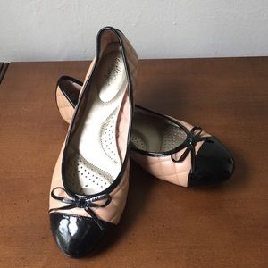 Pink and black ballet flats.