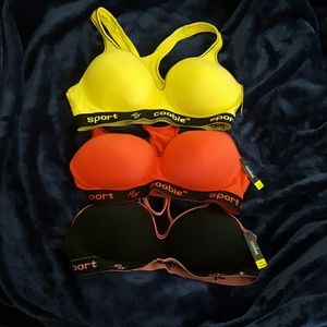 New w/tags padded sports bras. Set of 3.