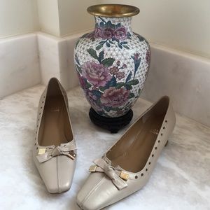 Stuart Weizmann pearlized beige kitten heels.