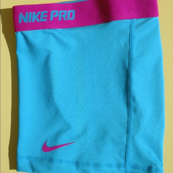 blue and pink nike pros