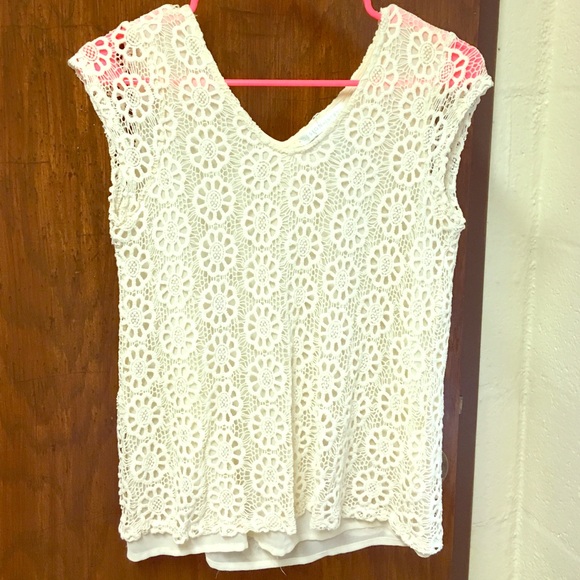 White, lace-patterned blouse