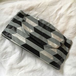 Geometric silver and black clutch
