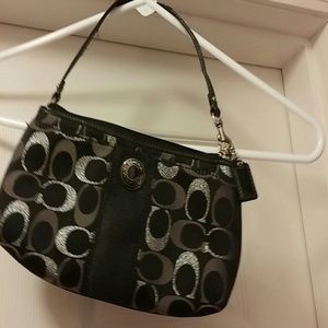 Black coach wristlet.