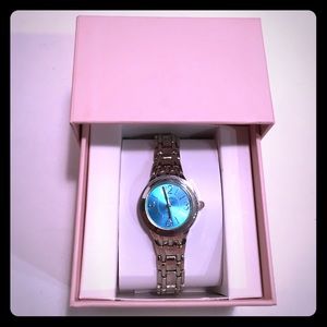 Silver watch with blue face