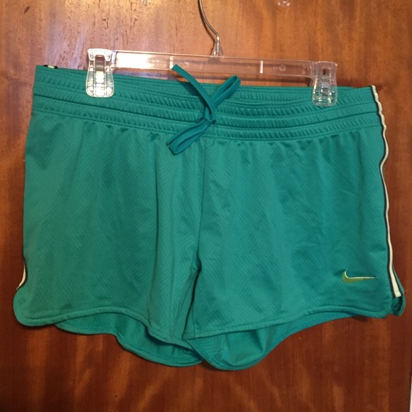 Green Nike running shorts