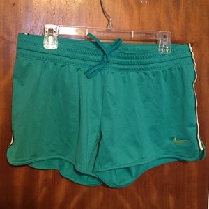 Green Nike running shorts