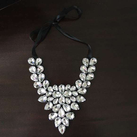 Diamond necklace with black ribbon tie.