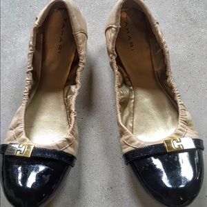 Nude and black flats.