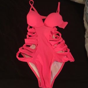 Pink cut out swimsuit .