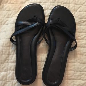 Black nurture leather flip flops