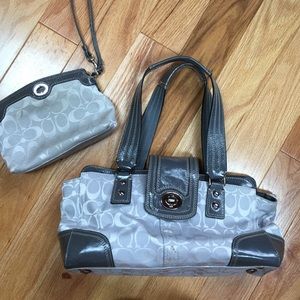 Grey coach bag with matching clutch.