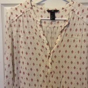 Soft white tunic top with dark rose floral print