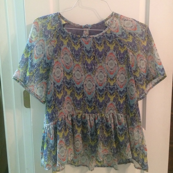 Printed peplum blouse with button up back.
