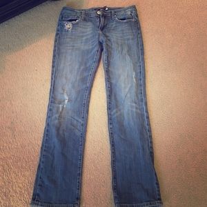 Jeans with back button pockets