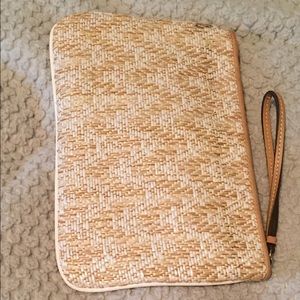 Tan and white clutch