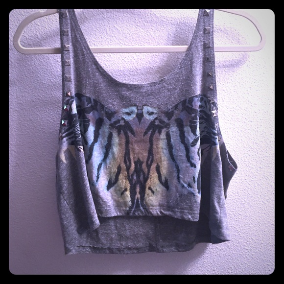 Crop top studded and has a mirrored tiger.